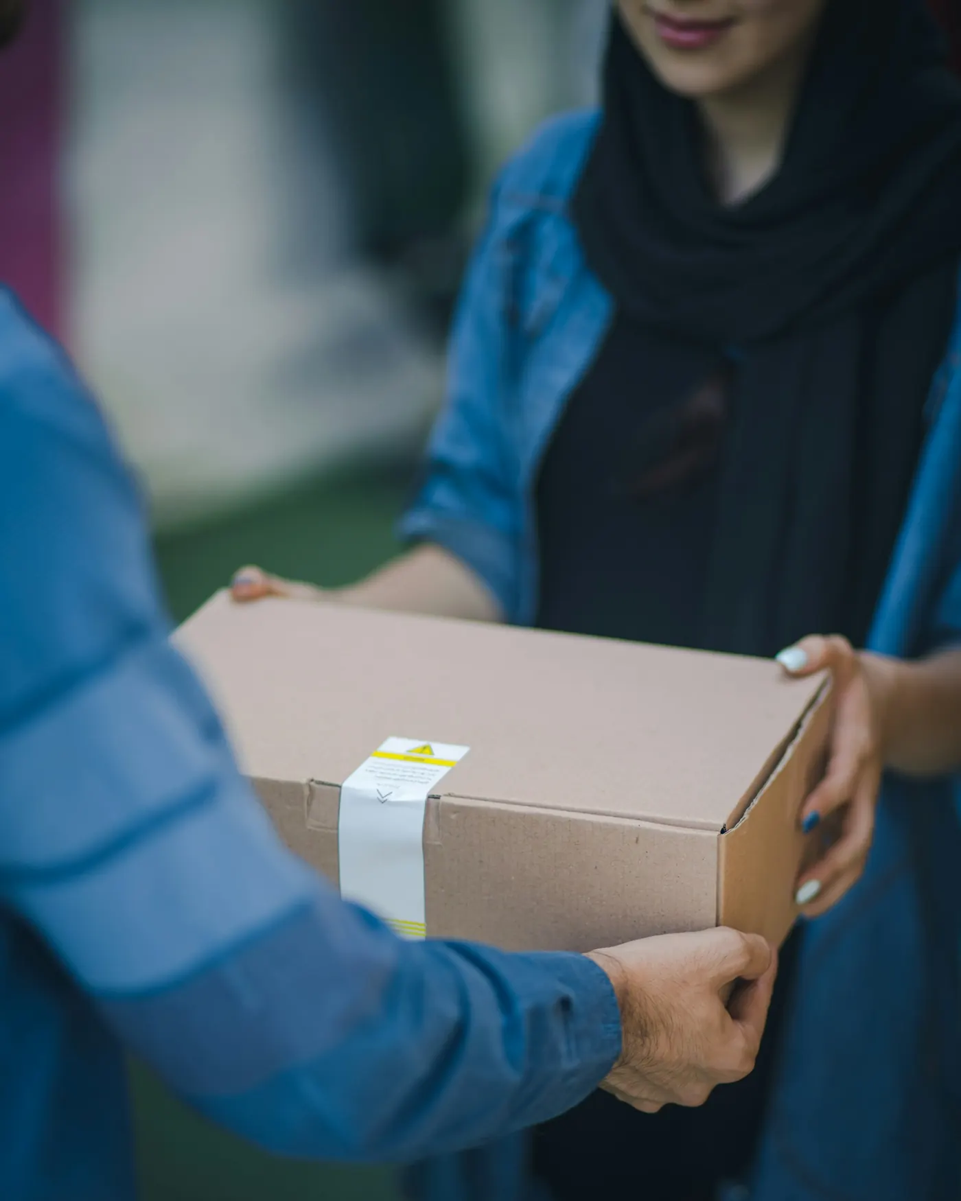 Person handing over a sealed package